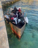 Seven Migrants in a Vessel Continue On