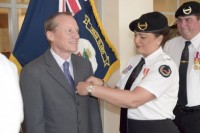 Governor gets poppy pinned by Veterans Association