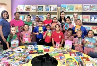 Stingray Swim Club and Rotary Sunrise Book Donation to Sir John A. Cumber Primary School