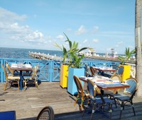 West Bay icon opens ‘Deck Dining’ and ‘To Go’