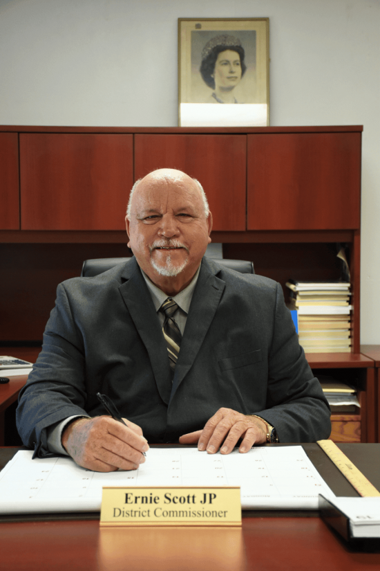 Passing of Former District Commissioner Mr. Ernie Scott JP Passing of Former District Commissioner Mr. Ernie Scott JP