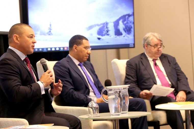 (Left to right) Infrastructure Minister, Hon. Joey Hew, the Most Hon. Andrew Holness, Prime Minster of Jamaica and Chairman Global Cities Center of Excellence, KPMG Canada, Steve Beatty during a panel discussion at the Caribbean Infrastructure Forum in Ja