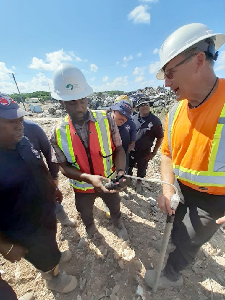 Dr. Tony Sperling (right) instructs crews from the Cayman Islands Fire Service and Department of Environmental Health during a four-day training exercise