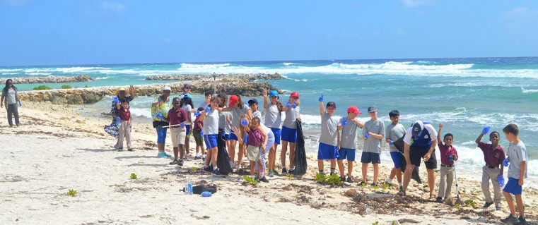 Students from LHS and CIS pick up trash in Beach Bay last Wednesday