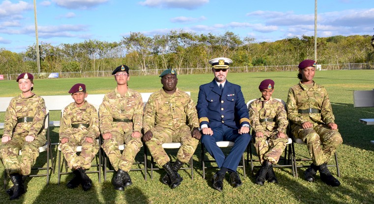 A Group Photo of the 4 newly appointed cadets from the Layman Scott High School Detachment, along with persons seated from the left Cpl Carter N, Lt C. Palmer & CDR R. Scotland