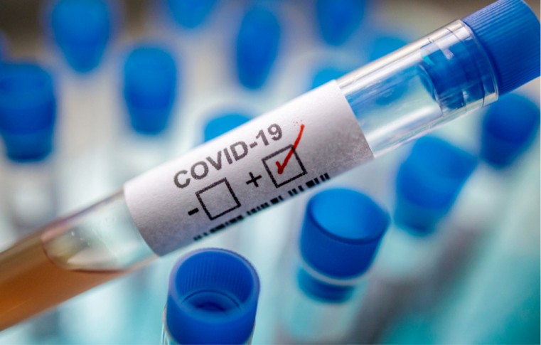 MASS TESTING KEY TO RELAXING RESTRICTIONS