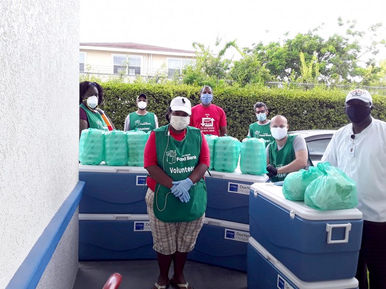 Volunteers prepare to deliver meals. The demands on Cayman Food Bank have increased as a result of the VOVID-19 pandemic