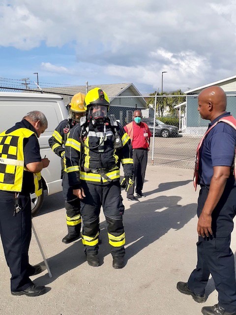 Breathing apparatus is donned prior to entering the test kit storage container