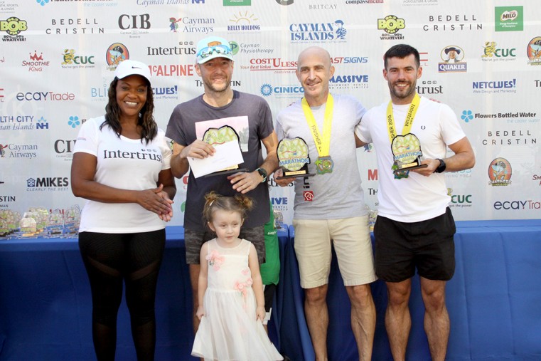 Nadine Watler-Ritter with 2019 Overall Male Marathon Winners Phil Reed, Steve Speirs and Sean Lilley