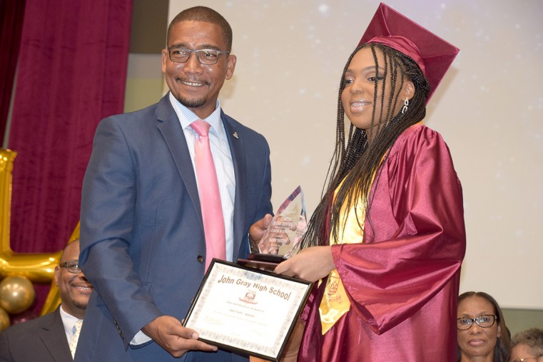 MLA Kenneth Bryan presents Brittany Wright Most outstanding student in Principles of Business