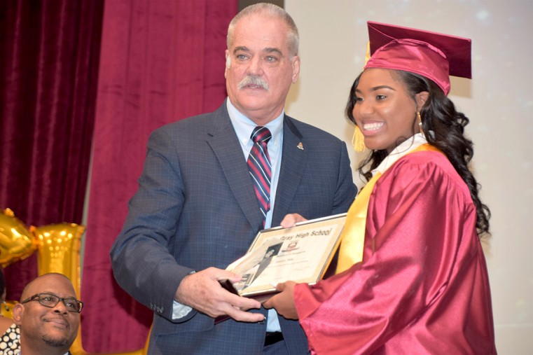Shante Reid receives the Most Outstanding Student in Leisure and Tourism Award from MLA David Wight