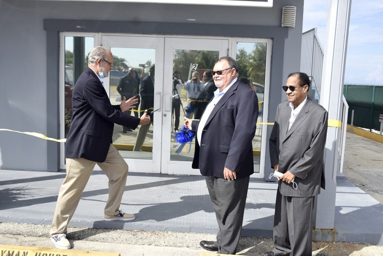 Cutting the ribbon to the new headquarters, (L-R) Donovan Ebanks, Ezzard Miller and Gilbert Connolly