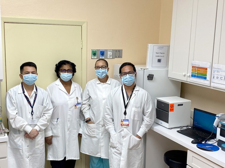Faith Hospital Laboratory staff with the new GeneXpert machine