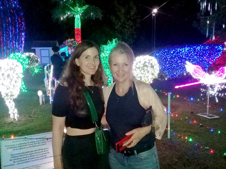 Guests on the National Trust for the Cayman Islands’ Christmas Lights Bus Tour enjoy lights during Christmas of 2019