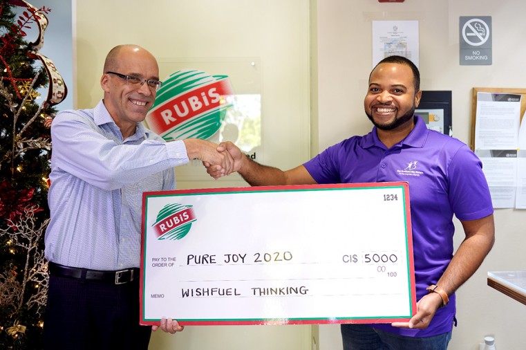 Rubis Managing Director Andres Barthel presents cheque to Big Brothers Big Sisters Director Patrick Barnes
