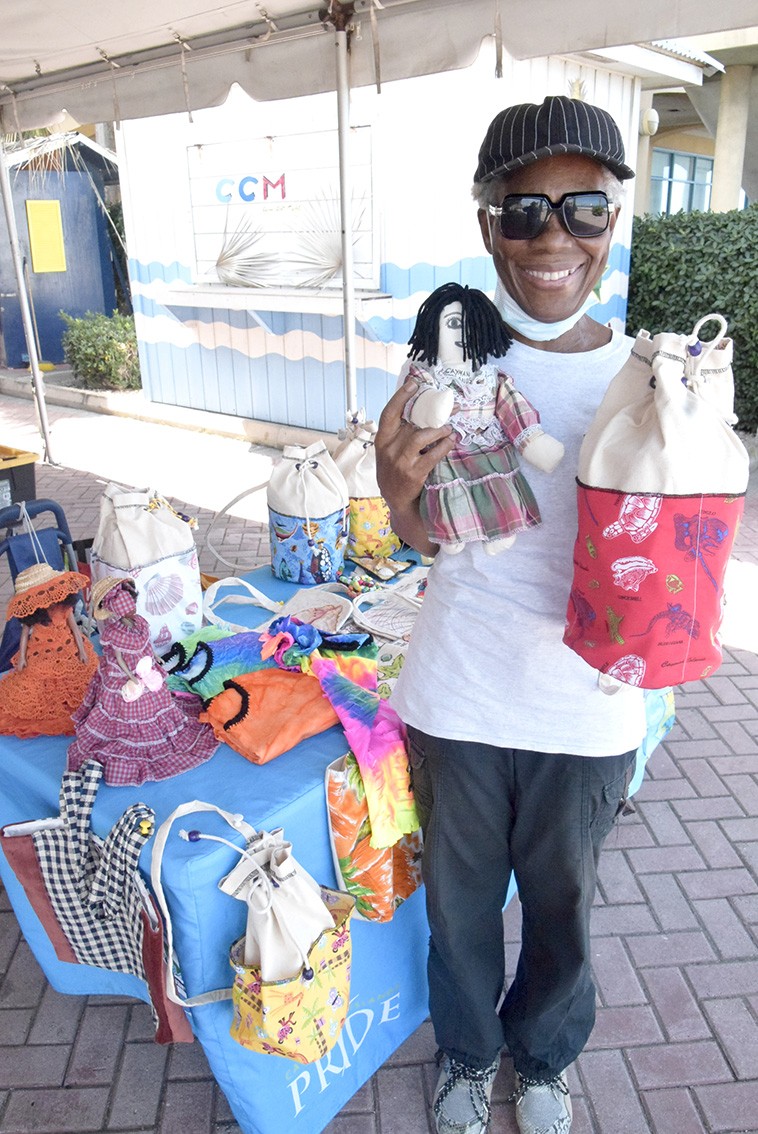 Sylvia Ebanks and her dolls, dresses and sewn bags
