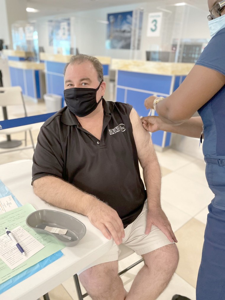 Pastor Dave Jorge, First Baptist Church, receives his first dose of the COVID vaccine