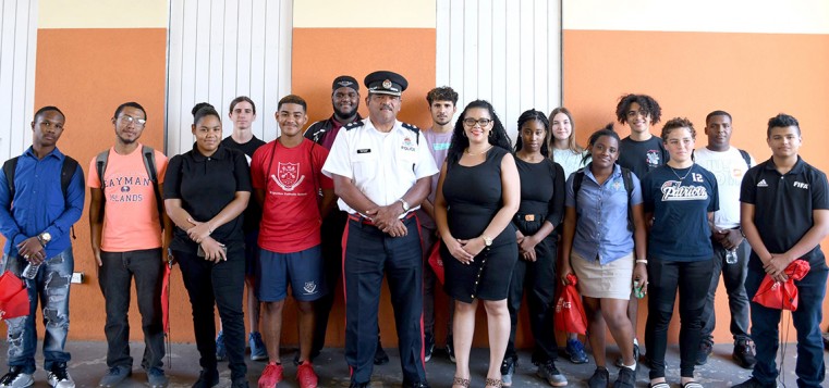 A/Supt. Brad Ebanks & HR Officer Samantha Bodden pose with the tour participants