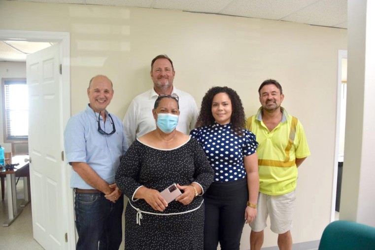 Minister O’Connor-Connolly poses proudly with a former John Gray High student and Government Scholarship recipient currently working on the project as a Quality Surveyor with McAlpine (L to R) Clive Baker, Principal Clark, Tracy Rankine and Steve Gaffing