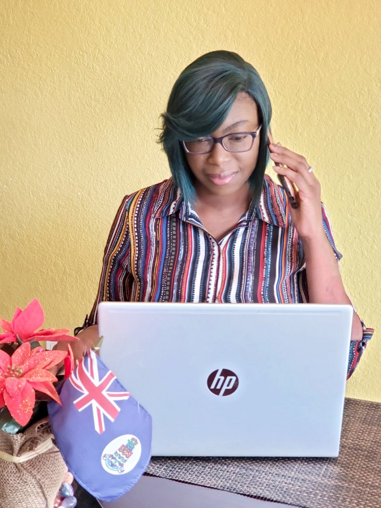 Senior Accountant Charlette Dixon communicates with the office by telephone while working from home
