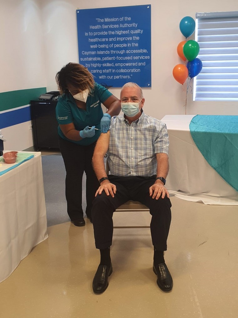 Minister McTaggart receiving his vaccination