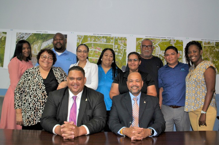 Minister of PAHI Hon. Jay Ebanks, Parliamentary Secretary Isaac Rankine and staff members of the National Housing Development Trust