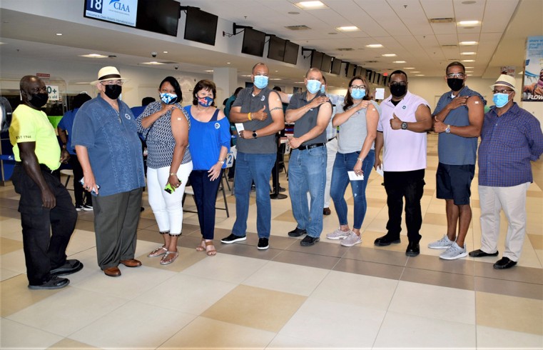 Government Ministers and MP’s proudly show their vaccination sticky-plasters. Photo includes Minister of Health Sabrina Turner, Chris Saunders, Kenneth Bryan, Katherine Ebanks-Wilks, Bernie Bush, Isaac Rankine, and McKeeva Bush