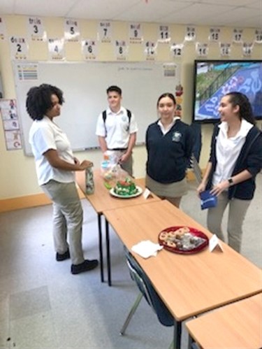 Hannah and her ‘Travibe’ team getting set up for a baking competition as part of their fundraising activities for their coursework