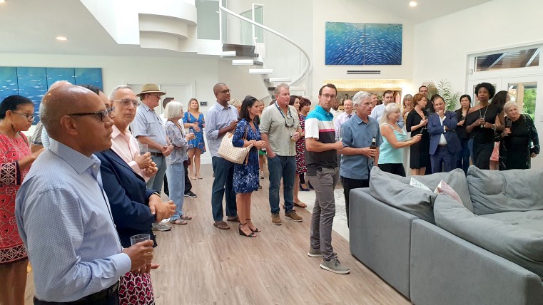 CEO of the Cayman Islands Stock Exchange Mr. Marco Archer and other gets look on as Author Michael Ferrier discusses his new book, ‘Cayman Kind’