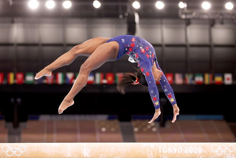 Biles wobbles but still impresses