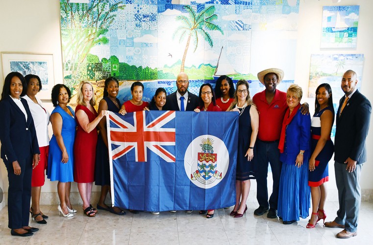 Minister for Youth, Sports, Heritage and Culture, Hon. Bernie Bush with Ministry staff show support for Team Cayman at the XXXII Tokyo Olympics