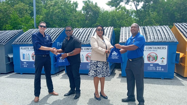DEH team arranging bins at the new recycling depot