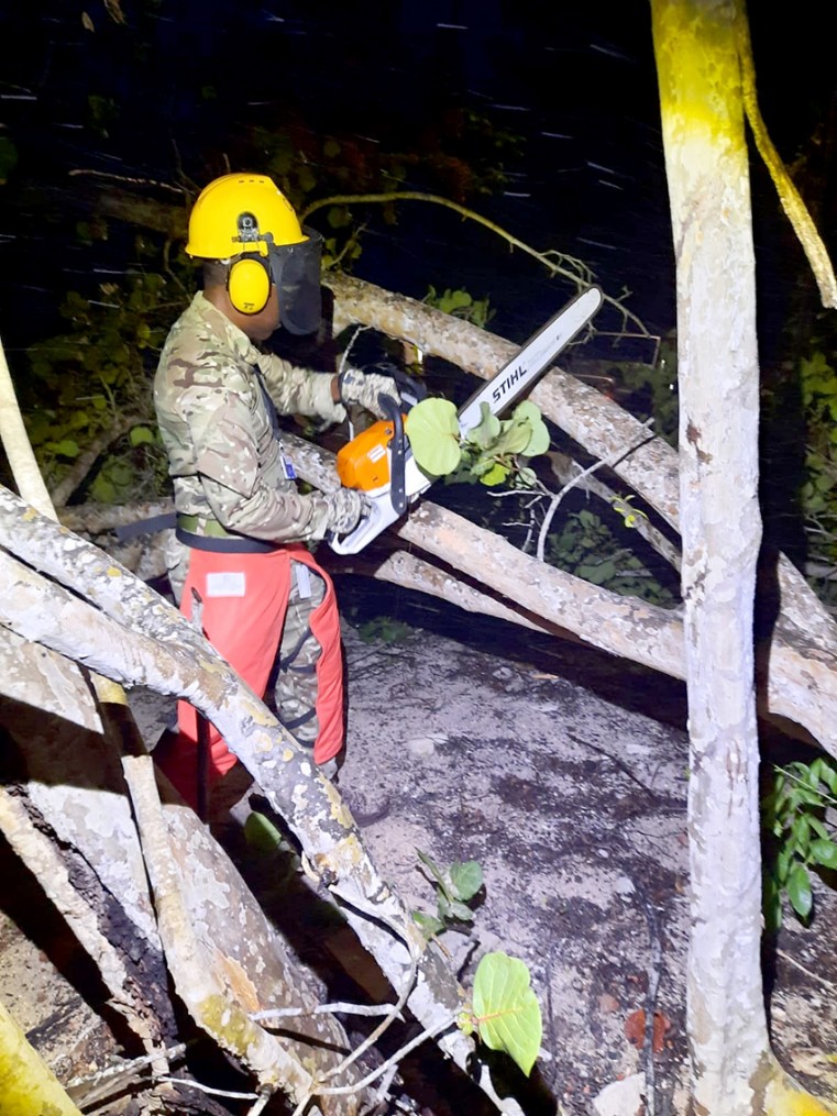 Chainsaw teams clear routes in Prospect prior to the storm