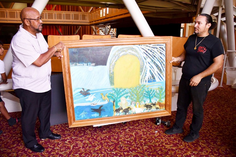 (L-R) Culture and Heritage Minister, Hon. Bernie Bush and Michael LeMay coordinator of a workshop sponsored by CNCF hold Let There Be Light by Miss Lassie at the Harquail Theatre