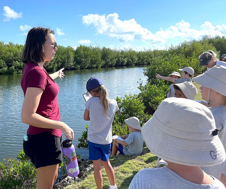 Mangrove Ranger Cassie McDowell and Year 2 students from Cayman International School