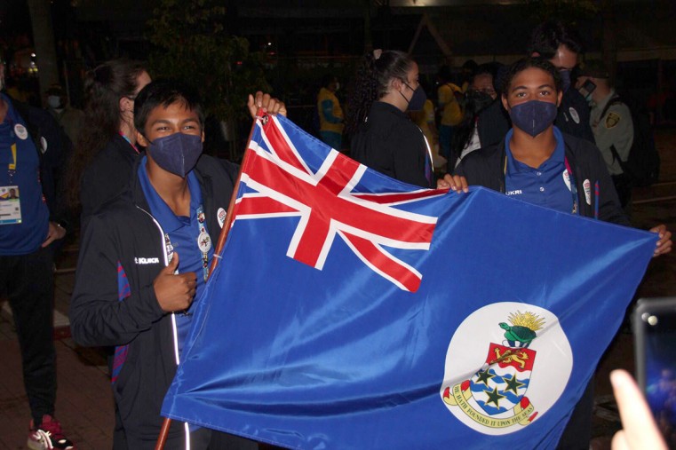 Cayman's junior Pan Am Games athletes proudly wave the CaymanIslands flag