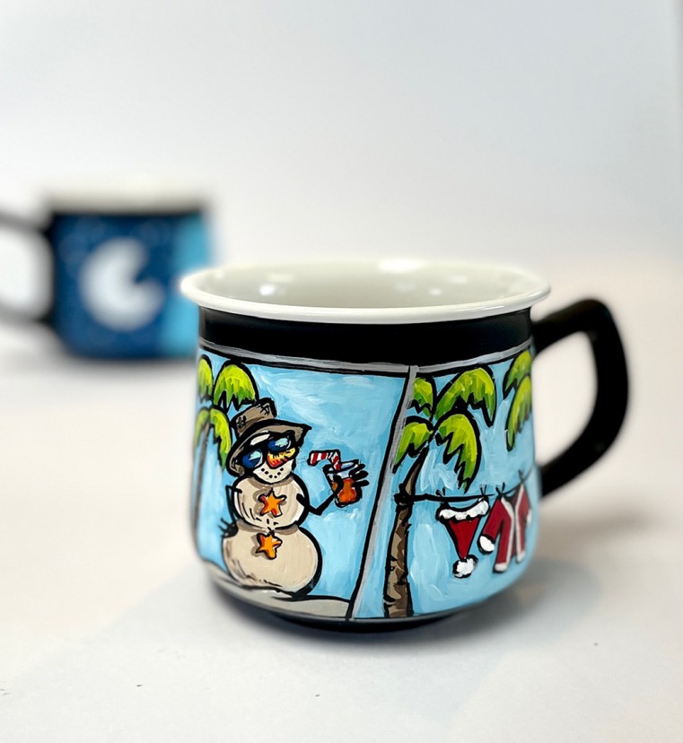 “Tis the SEA*SUN” hand-painted ceramic coffee mugs, that includes a tropical Christmas design CI$25