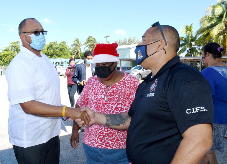 Issac Rankine MP for East End discusses the event with Division Manager Randy Rankin