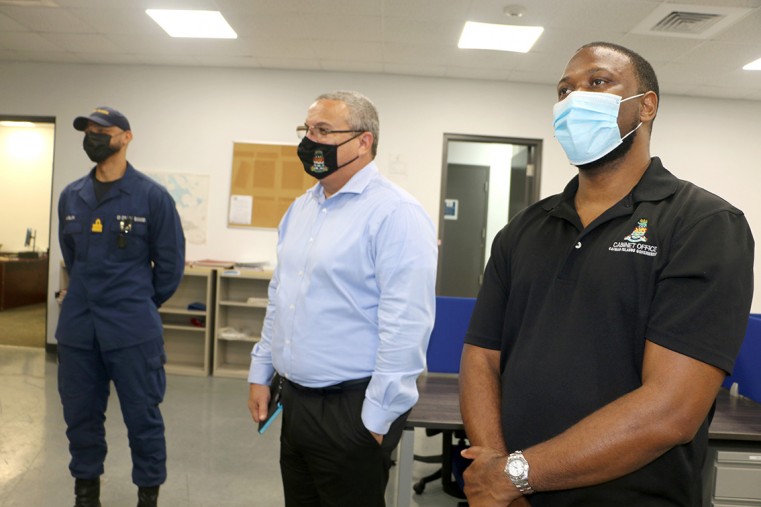 (L-R) Coast Guard Deputy Commander Leo Anglin, Deputy Governor Franz Manderson, Cabinet Secretary Samuel Rose inside Coast Guard HQ.