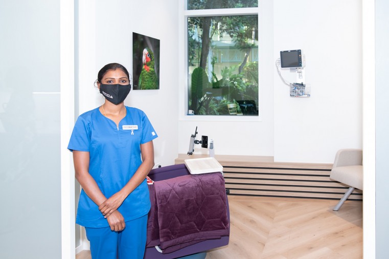 Oncology Suite: Nurse Roobathy stands outside one of the private treatment rooms at the Oncology Day Care Suite.