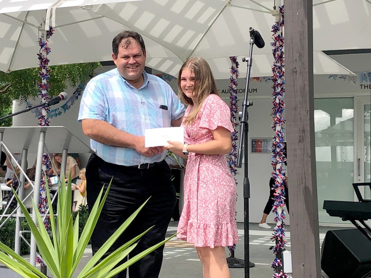Poetry winner Kylah recives her prize from Premier Panton