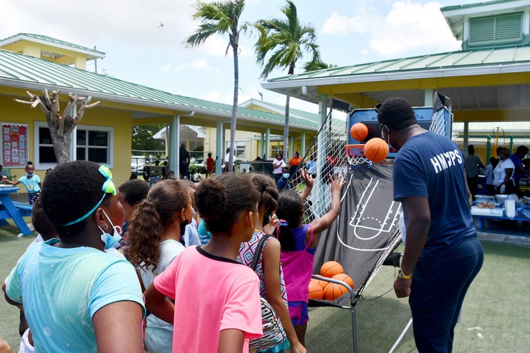 HMCIPS Officer coordinating Basketball games with Theoline L. McCoy Primary School Students.