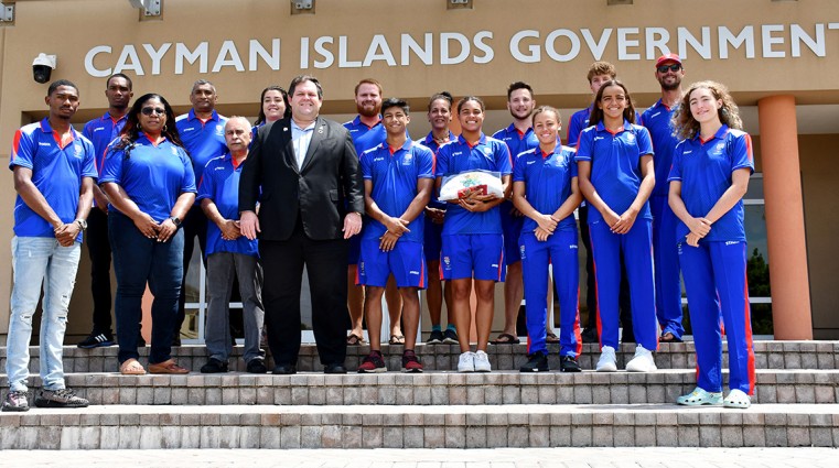 Team Cayman delegates, attending the Commonwealth Games shortly, take part in a photo opportunity with Premier, Hon Wayne Panton and CIOC Chef de Mission Mrs. Janet Sairsingh in front of the Governmen