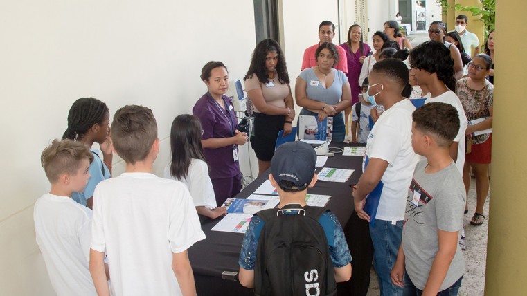 Nurse Chitra engages students about the importance of taking and knowing vital statistics.