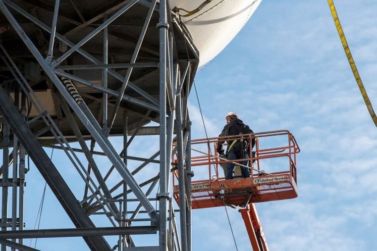 An engineer works on the dome
