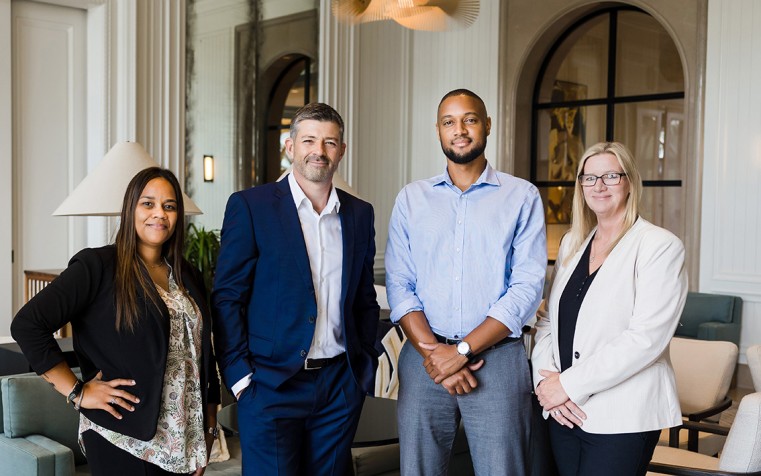 Members of the Cayman Finance Team. L-R: Tamika Hue (Operations Manager), Steve McIntosh (CEO), Travis Webster ((Communications & PR Support) & Anita Law (PR, Communications & Event Manager)