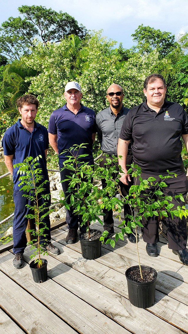 From left, Queen Elizabeth II Botanic Park Horticulturalist Corin Golding, Manager John Lawrus, Tourism Attraction Board Director Patrick Thompson, and Premier and Minister of Sustainability & Climate
