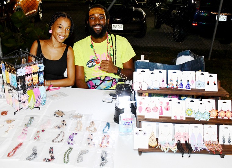 Local vendors Justine Jervis and Luke Gonzalez sell artisanal products at Cayman Christmas: A Celebration of Culture & Music, West Bay Heritage Park, Wednesday, 14 December 2002.