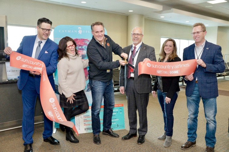 Daniel Taugher (Cayman Islands Department of Tourism), Ty Bricker (Sun Country), Jude Bricker (CEO, Sun Country Airlines), Roy Fuhrmann ( Chief Operating Officer, Metropolitan Airports Commission), Da