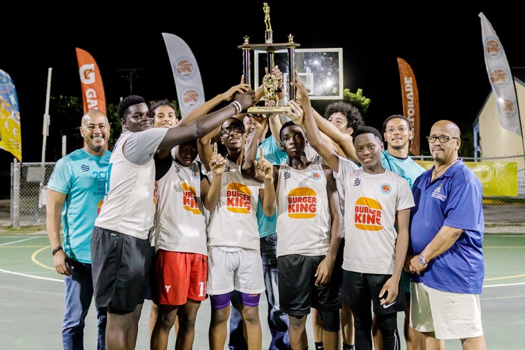 West Bay Central wins West Bay’s U16 Rally. The U16 team is joined of Director of Sports Mr. Kurt Hyde (far left) and Minister for Youth & Sports, Hon. Bernie Bush (far right) at the Sir John A. Cumbe